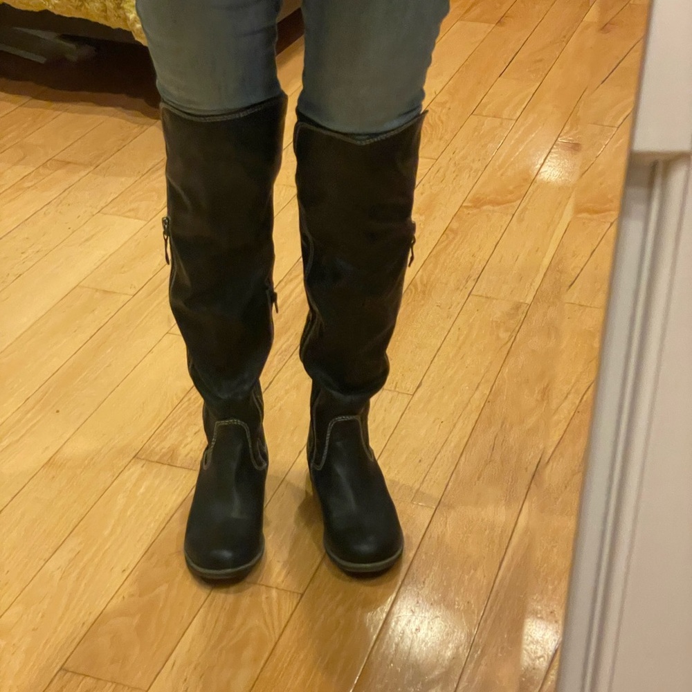 Black Knee-High Women's Boot with white stitching.